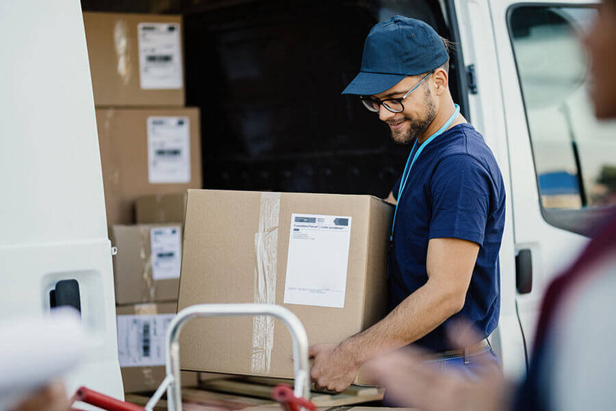 Delivery man moving a box